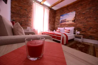 Łóżko lub łóżka w pokoju w obiekcie Willa Starowiejska