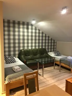 Łóżko lub łóżka w pokoju w obiekcie Sokół