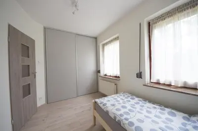 Łóżko lub łóżka w pokoju w obiekcie Apartament Zebcowska