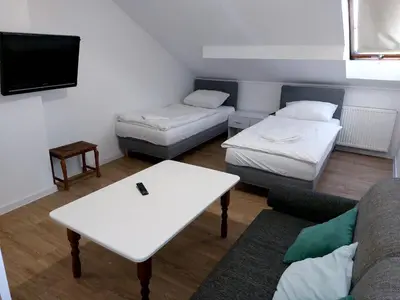 Łóżko lub łóżka w pokoju w obiekcie Zajazd Różany