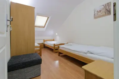 Łóżko lub łóżka w pokoju w obiekcie Zajazd Różany