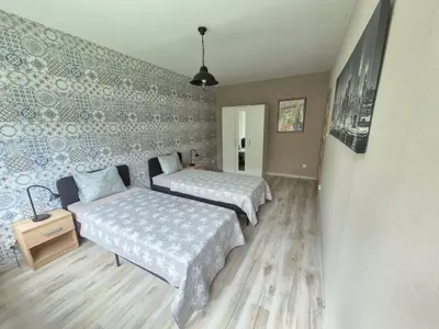 Łóżko lub łóżka w pokoju w obiekcie JDK Apartamenty Serbinowska 53m2 6-osobowy
