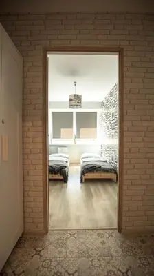 Łóżko lub łóżka w pokoju w obiekcie JDK Apartamenty Serbinowska 53m2 6-osobowy