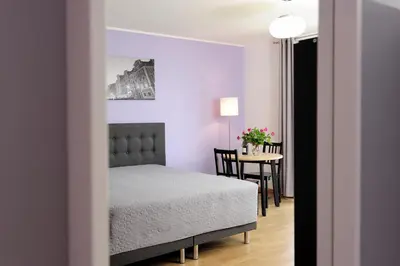 Łóżko lub łóżka w pokoju w obiekcie Sleep Well Wroclavia / Dyrekcyjna