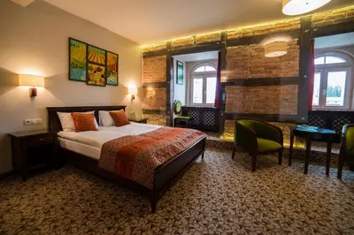 Łóżko lub łóżka w pokoju w obiekcie Hotel Starka
