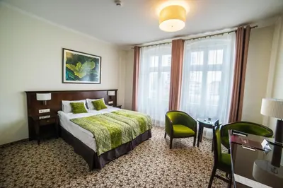 Łóżko lub łóżka w pokoju w obiekcie Hotel Starka