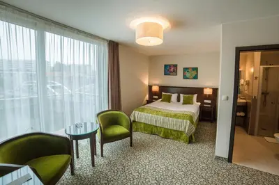 Łóżko lub łóżka w pokoju w obiekcie Hotel Starka