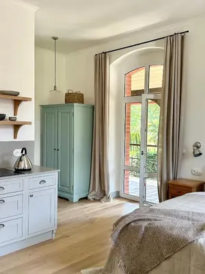 Łóżko lub łóżka w pokoju w obiekcie Lawenda Apartamenty Boutique
