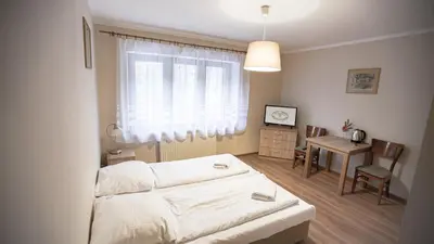 Łóżko lub łóżka w pokoju w obiekcie Dom Nad Wodospadem