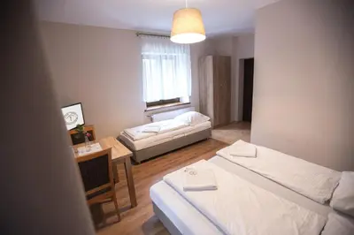 Łóżko lub łóżka w pokoju w obiekcie Dom Nad Wodospadem