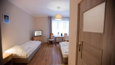 Łóżko lub łóżka w pokoju w obiekcie Dom Nad Wodospadem