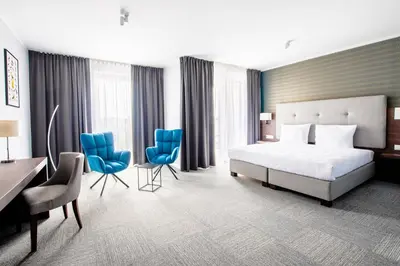 Łóżko lub łóżka w pokoju w obiekcie Hotel Weneda