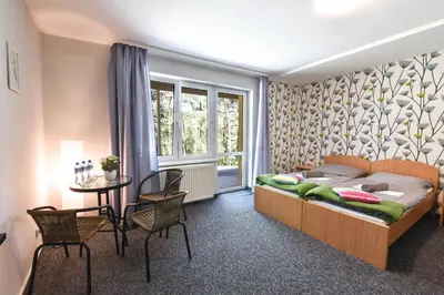 Łóżko lub łóżka w pokoju w obiekcie KAMION Ośrodek Wypoczynkowy