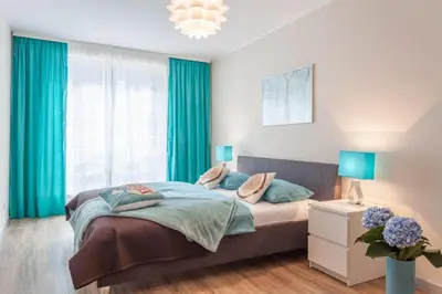 Łóżko lub łóżka w pokoju w obiekcie AbsyntApartments 24 Rynek Wrocław