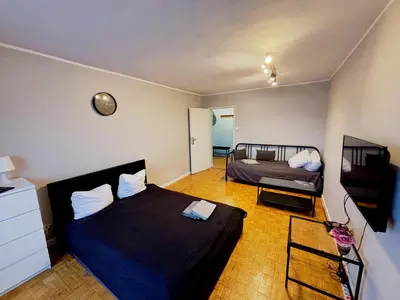 Łóżko lub łóżka w pokoju w obiekcie Stanisława Dubois 29, Wrocław