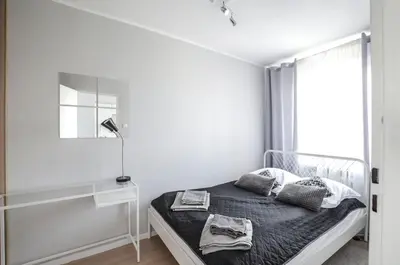 Łóżko lub łóżka w pokoju w obiekcie Stanisława Dubois 29, Wrocław