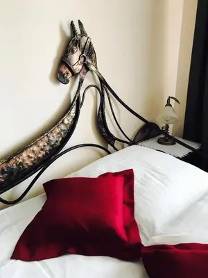 Łóżko lub łóżka w pokoju w obiekcie Hotel Stajnia Wolica