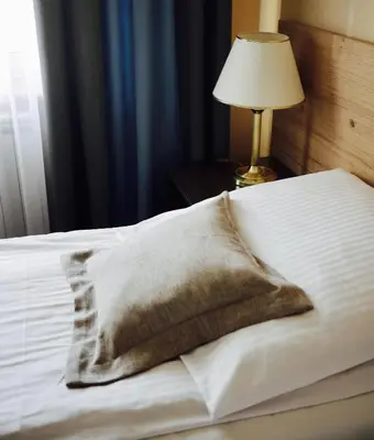 Łóżko lub łóżka w pokoju w obiekcie Hotel Stajnia Wolica