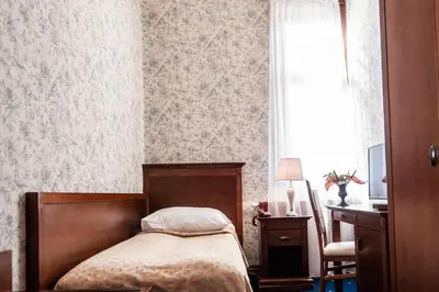 Łóżko lub łóżka w pokoju w obiekcie Pałac Myśliwski w Antoninie
