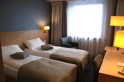 Łóżko lub łóżka w pokoju w obiekcie Hotel Lazur SPA & Conference