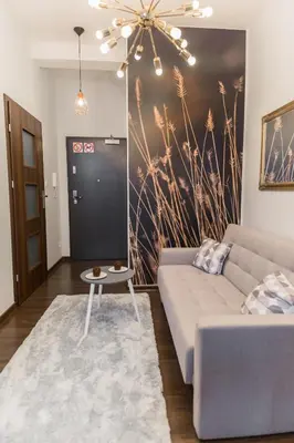 Łóżko lub łóżka w pokoju w obiekcie GoldenEye Apartment Center