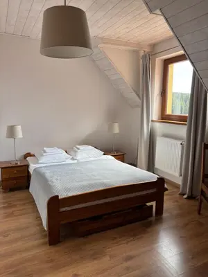 Łóżko lub łóżka w pokoju w obiekcie Doboszowka