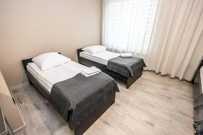 Łóżko lub łóżka w pokoju w obiekcie Apartamenty Wawrzyniak