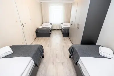 Łóżko lub łóżka w pokoju w obiekcie Apartamenty Wawrzyniak