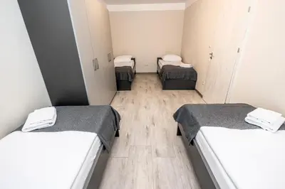 Łóżko lub łóżka w pokoju w obiekcie Apartamenty Wawrzyniak