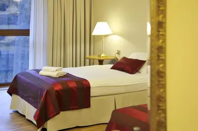 Łóżko lub łóżka w pokoju w obiekcie Hotel Mir-Jan SPA