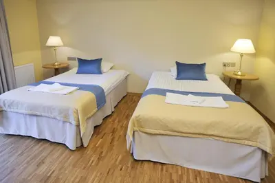 Łóżko lub łóżka w pokoju w obiekcie Hotel Mir-Jan SPA