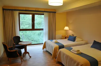 Łóżko lub łóżka w pokoju w obiekcie Hotel Mir-Jan SPA
