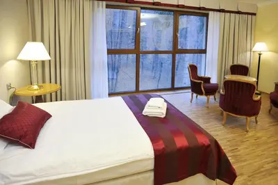 Łóżko lub łóżka w pokoju w obiekcie Hotel Mir-Jan SPA