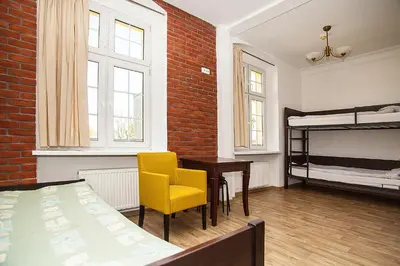 Łóżko lub łóżka w pokoju w obiekcie Hostel Wratislavia