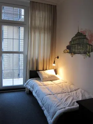 Łóżko lub łóżka w pokoju w obiekcie Hostel Wratislavia
