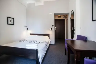 Łóżko lub łóżka w pokoju w obiekcie Hostel Wratislavia