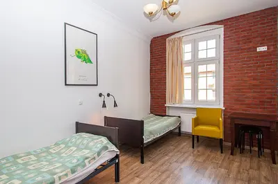 Łóżko lub łóżka w pokoju w obiekcie Hostel Wratislavia