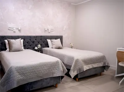 Łóżko lub łóżka w pokoju w obiekcie Apartamenty Pyskowice