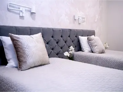 Łóżko lub łóżka w pokoju w obiekcie Apartamenty Pyskowice