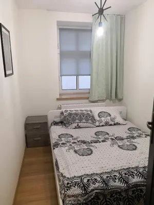 Łóżko lub łóżka w pokoju w obiekcie Apartamenty Górskie LĄDEK-ZDRÓJ