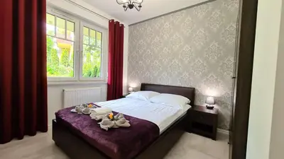 Łóżko lub łóżka w pokoju w obiekcie Lux Apartment Park