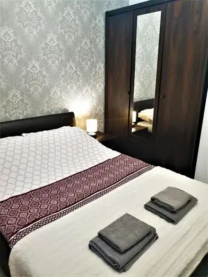 Łóżko lub łóżka w pokoju w obiekcie Lux Apartment Park