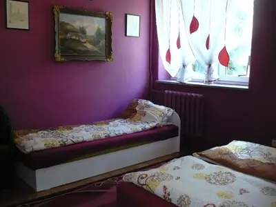Łóżko lub łóżka w pokoju w obiekcie Pokoje gościnne u Andrzeja