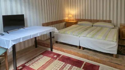 Łóżko lub łóżka w pokoju w obiekcie Dom Gościnny BIEGUN