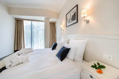 Łóżko lub łóżka w pokoju w obiekcie Hotel Trzebnica