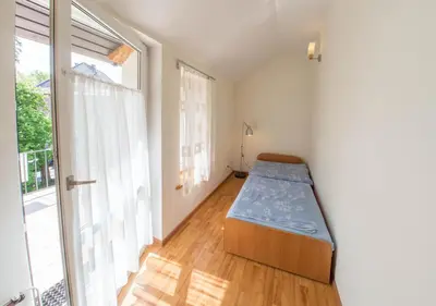Łóżko lub łóżka w pokoju w obiekcie Apartament Zdrojowy przy Parku