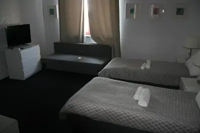 Łóżko lub łóżka w pokoju w obiekcie Drukarnia Smaku