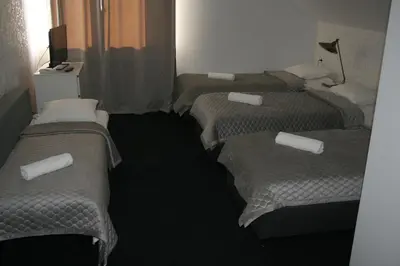 Łóżko lub łóżka w pokoju w obiekcie Drukarnia Smaku