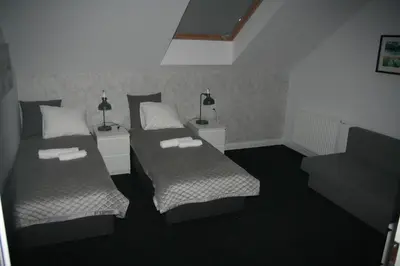 Łóżko lub łóżka w pokoju w obiekcie Drukarnia Smaku