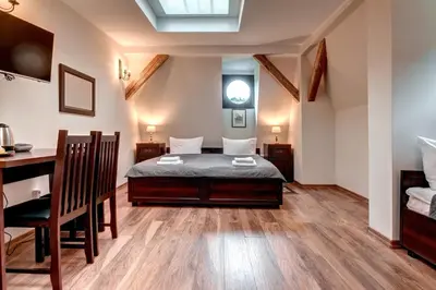 Łóżko lub łóżka w pokoju w obiekcie Hotel Charlotta